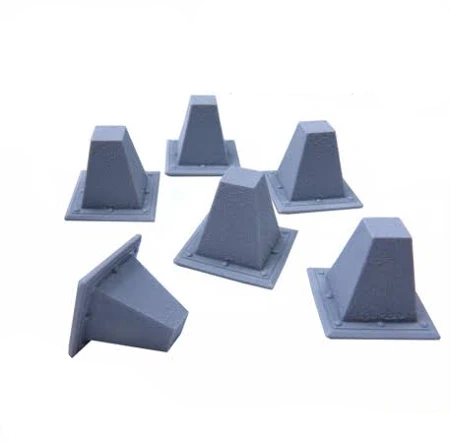 Set of six gray resin dragon teeth traps with 'Green Stuff World' branding on a white background.