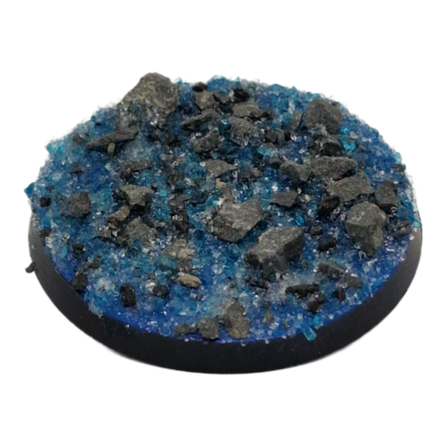 Round base with blue gravel and black rocks on a white background