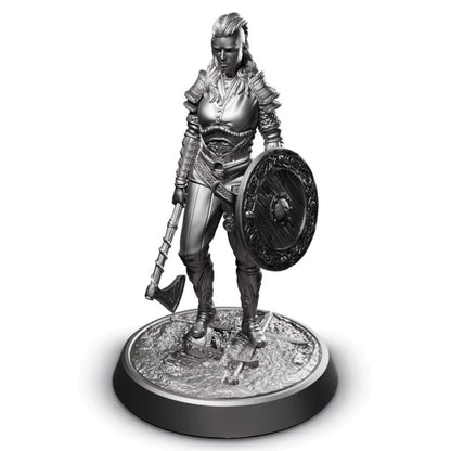 Metallic figurine of a warrior with armor, axe, and shield on a white background