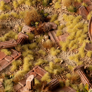 Miniature landscape with ruins and greenery, likely for model or hobby use.