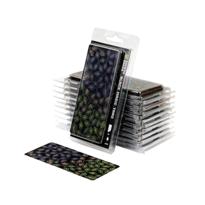 Stack of trading card packs with a single card displayed in front on a white background