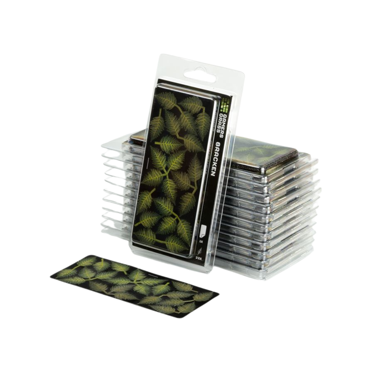 A pack of miniature leaf foam accents in a clear blister pack with a hanger tab, shown alongside a stack of similar packs and a single flat piece of the leaf pattern on a white background.