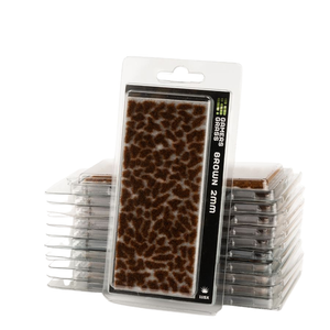 Packaged brown ground paint brush pads stacked in clear plastic clamshell cases on a white background.