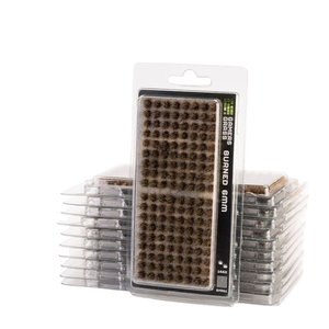 Packaged dark brown burned bristle cleaning brushes stacked in clear plastic clamshell trays, with one package standing upright in front on a white background.