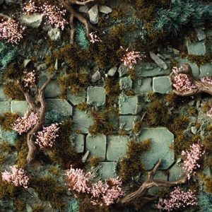 Mossy stone wall with pink flowers and branches