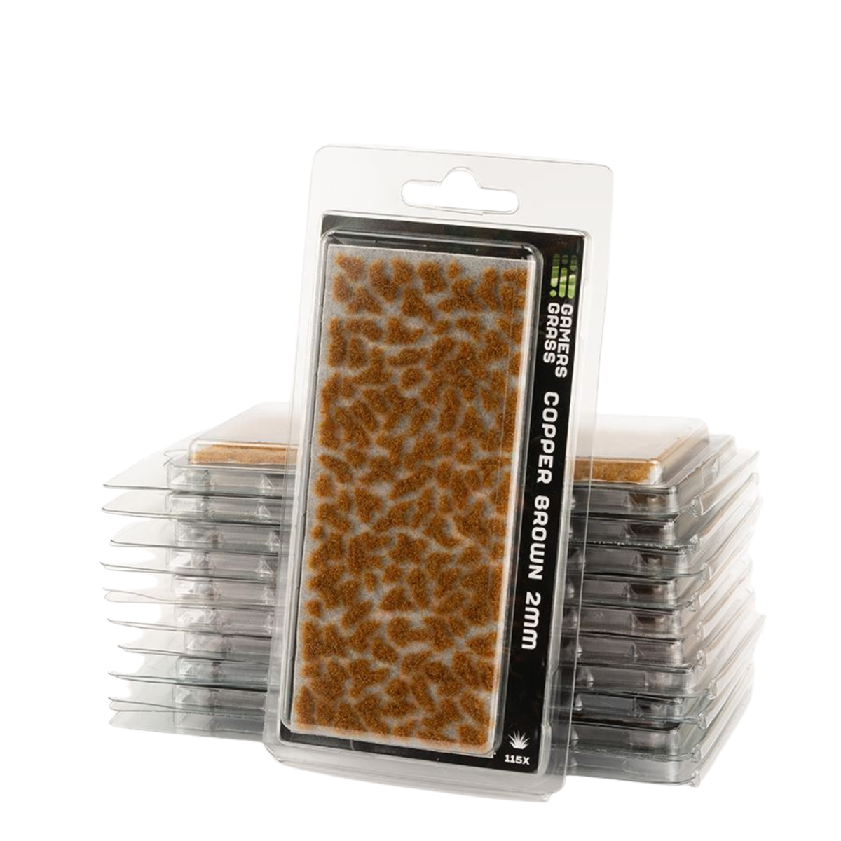 Packaged miniature terrain pieces labeled 'COPPER BROWN 2mm' in a clear blister pack, with several additional packs stacked behind it on a white background.