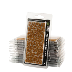Packaged miniature terrain pieces labeled 'COPPER BROWN 2mm' in a clear blister pack, with several additional packs stacked behind it on a white background.