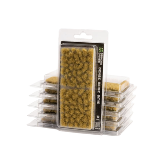 Pack of miniature grass dens, featuring a large central package of dense beige-brown grass with smaller stacks of similar packages behind it, all on a white background.