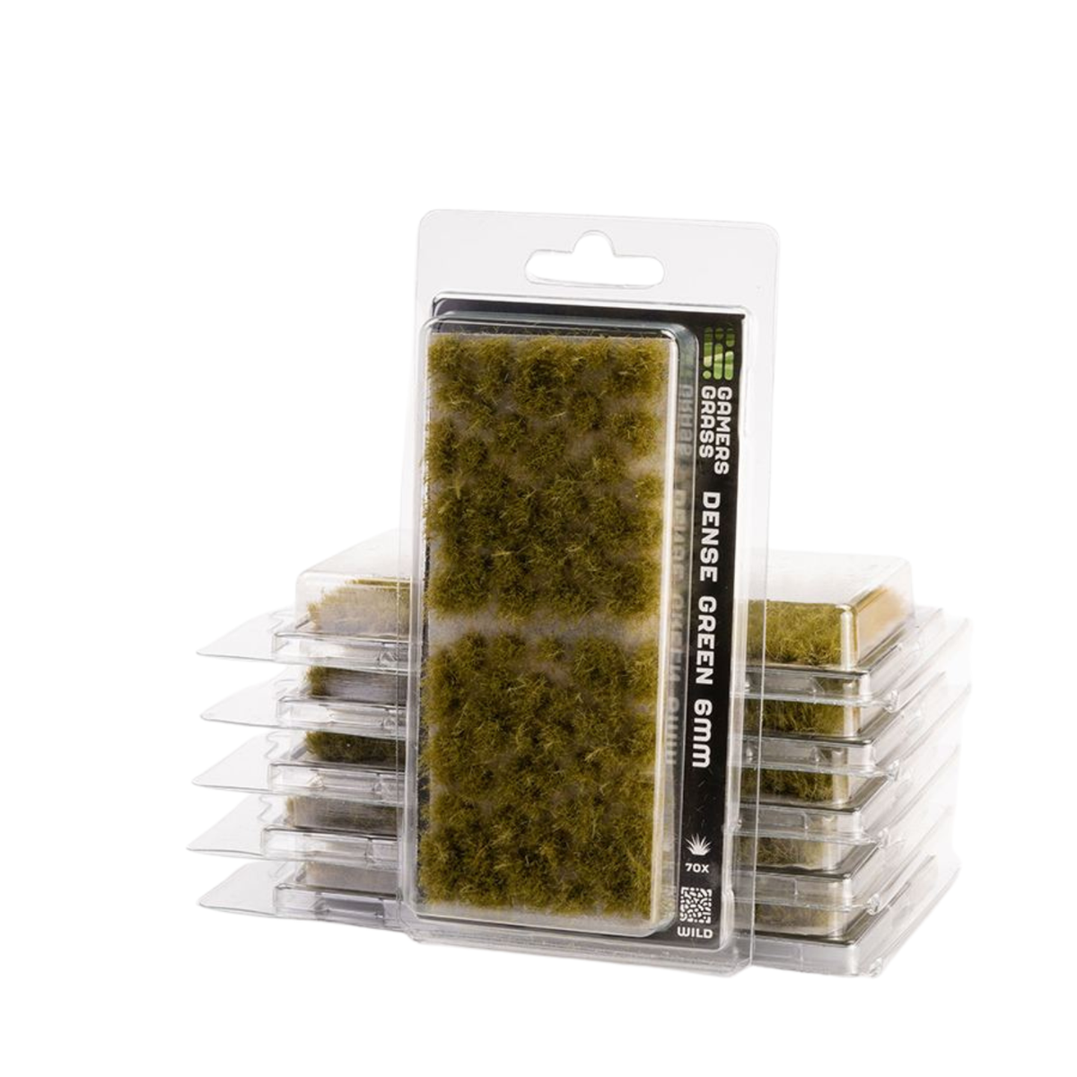 Packaged green artificial moss or turf pieces in a clear plastic blister pack, with additional stacked packs visible behind it on a white background.