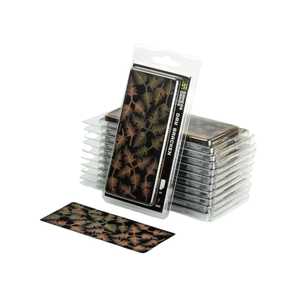 A pack of miniature foliage decals displayed in a clear blister pack with a single decal sheet placed in front, showing a detailed brown and green leaf pattern on a black background.