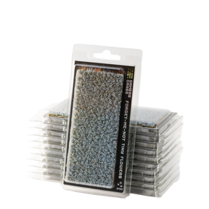 A pack of Ranger Series Forget-Me-Not Fine Flower Coating sheets, with one sheet in its clear plastic blister packaging standing in front of a stack of other sheets on a white background.