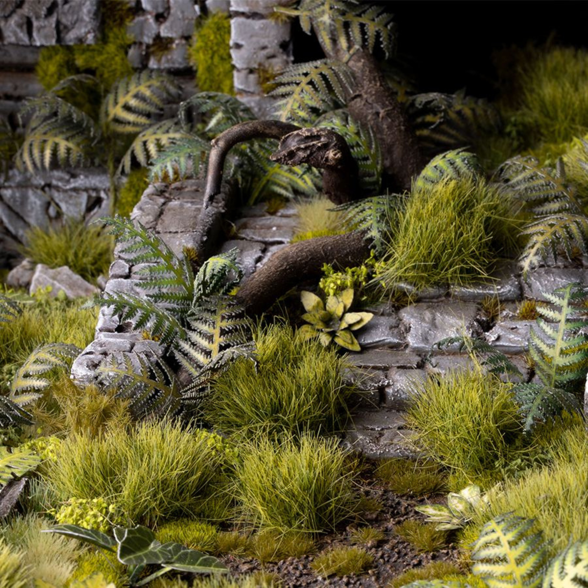 Detailed miniature landscape with stone pathways, plants, and trees