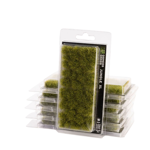 Packaged green artificial moss or jungle grass plugs in clear plastic clamshell packaging, with one larger package in front and several smaller packages stacked behind it on a white background.