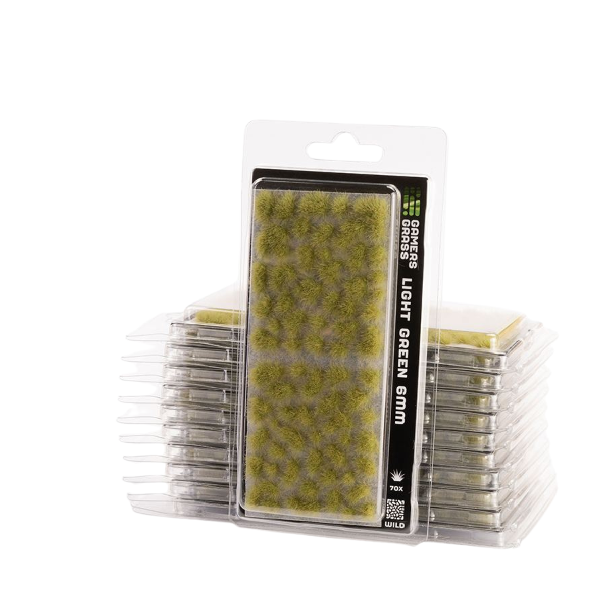 Pack of Grass Grasses Light Green 6mm artificial turf pieces in clear plastic blister packaging, with stacks of the same pieces visible behind.