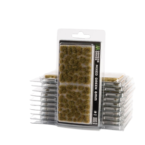 Packaged mixed green grass brush for tabletop wargaming, with a single carded pack in front of a stack of identical packs on a white background.