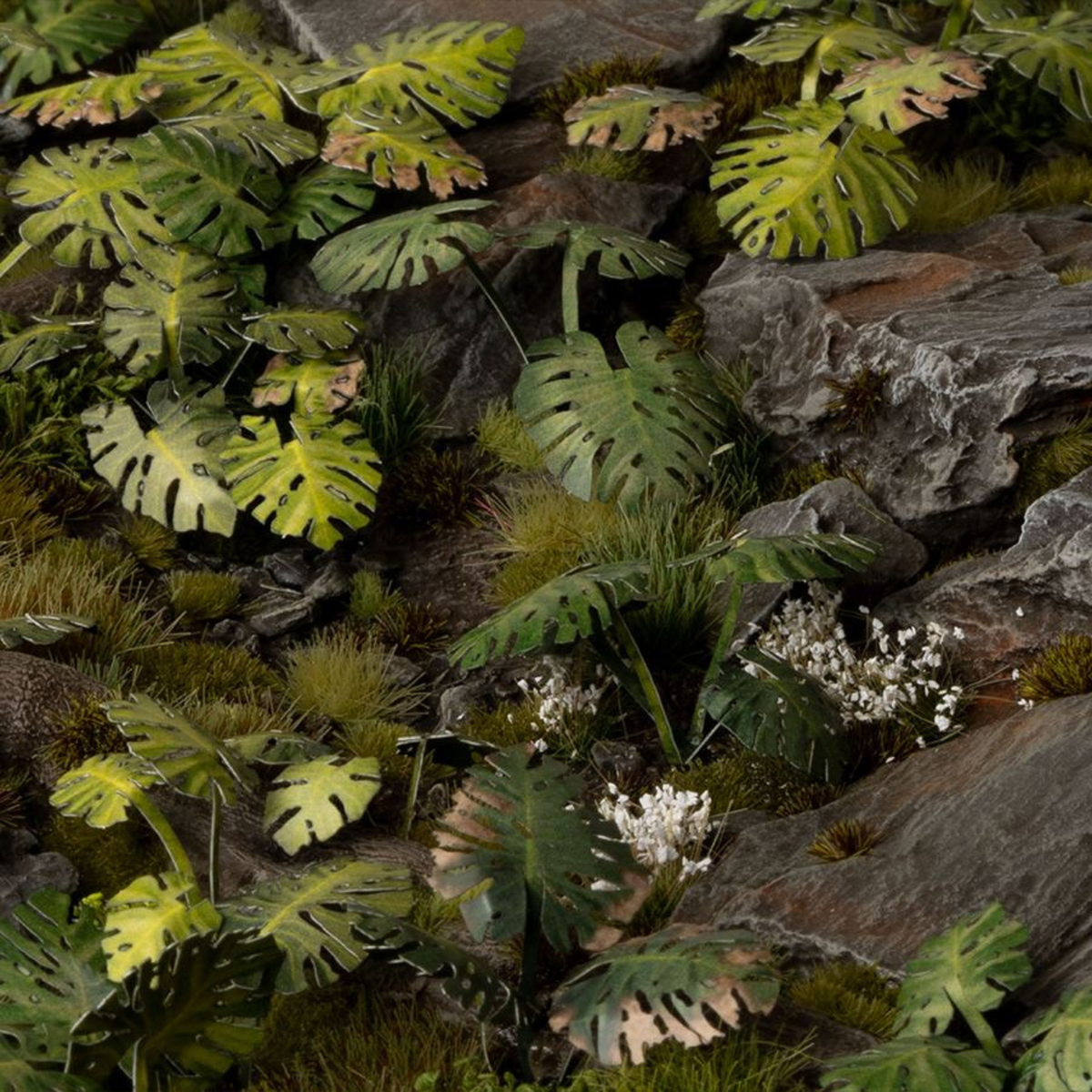 Artificial greenery with leaves and rocks for decorative purposes