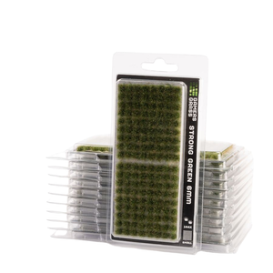 Pack of 16x Green Grass Strong Green SMM artificial turf plugs in clear plastic blister packaging, with two stacks of the same product behind the main front package.
