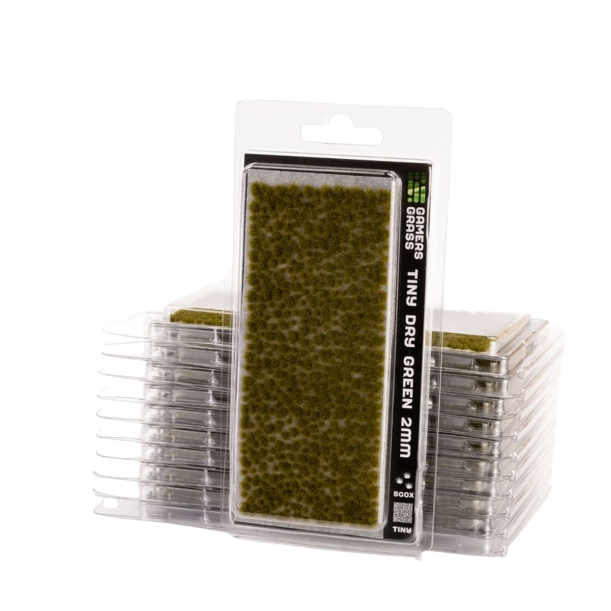 A pack of Greenheads Tins Dry Green 2mm miniature terrain pieces in clear plastic blister packaging, with additional stacks of the same pieces visible behind it on a white background.