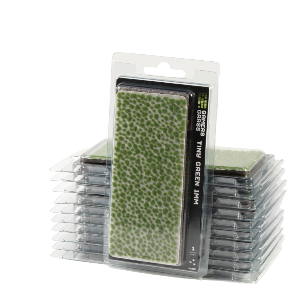 Packaged green textured turf or grass replacement material in a clear plastic blister pack, with additional stacked packs visible behind it on a white background.