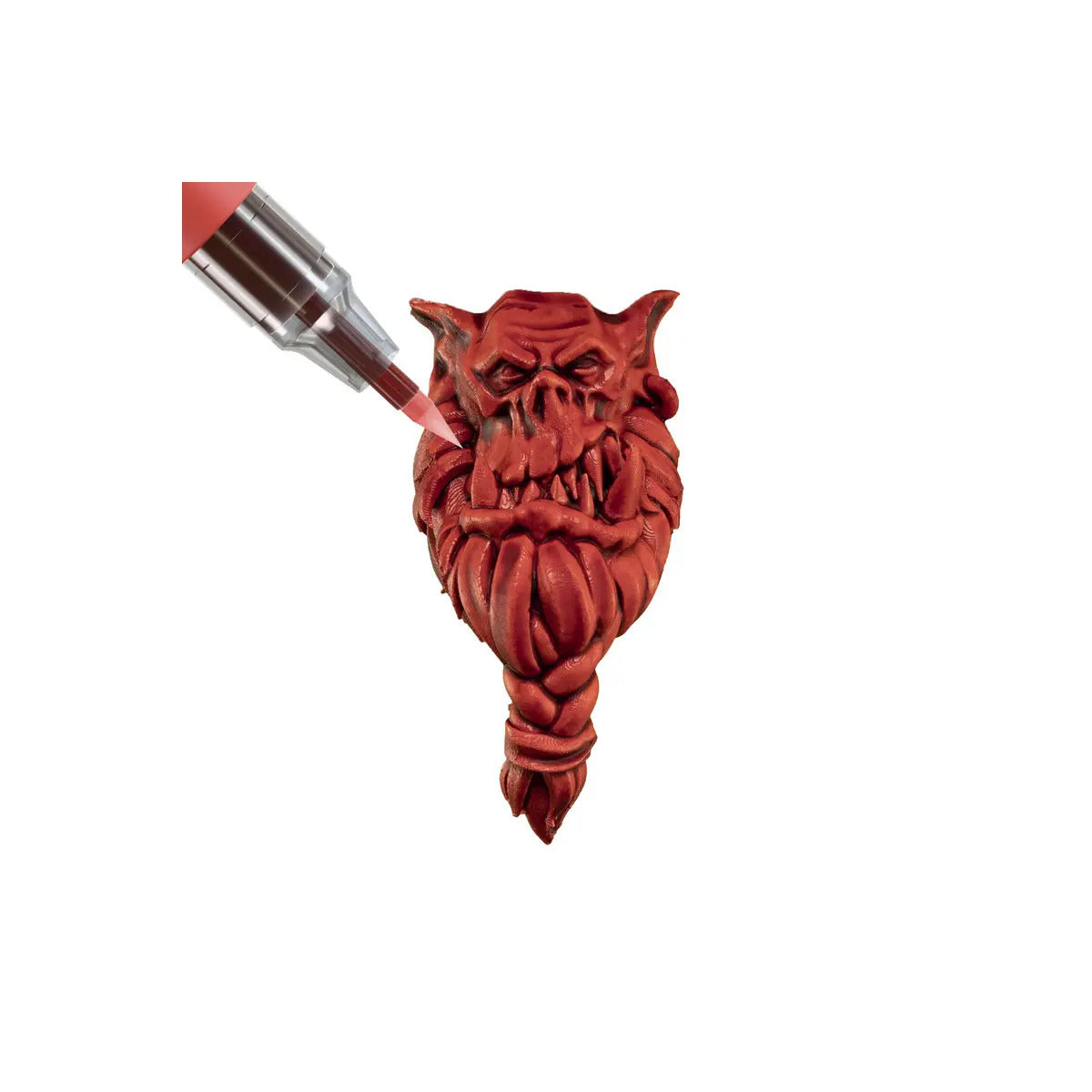 Red devil-shaped bottle stopper on a white background